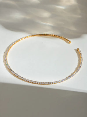 Gold collar necklace with a full row of diamonds