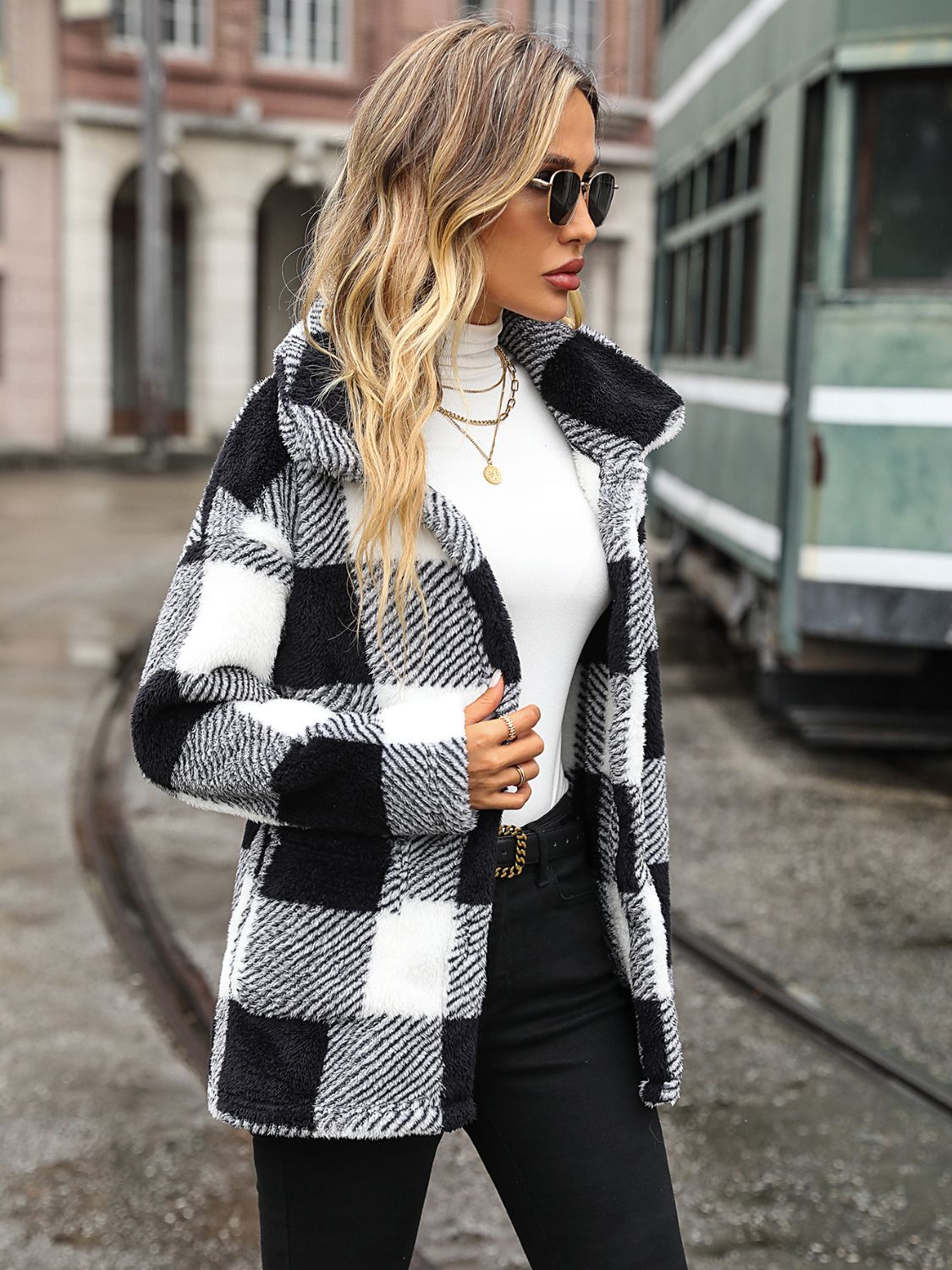 Textured plaid teddy button-up jacket in black and white, with a relaxed fit and collared neckline.