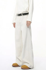 Light wash denim jeans with stitched edges and a straight-leg cut.