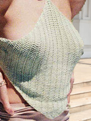 Crochet halterneck triangle top in light green with a backless design.