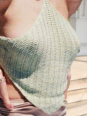 Crochet halterneck triangle top in light green with a backless design.