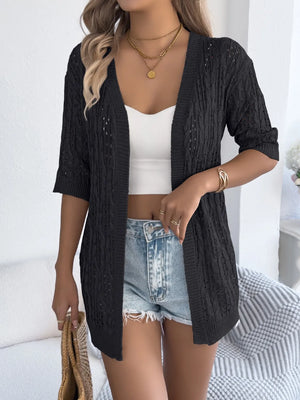 Black open-knit three-quarter sleeve cardigan with cable knit texture and open front.