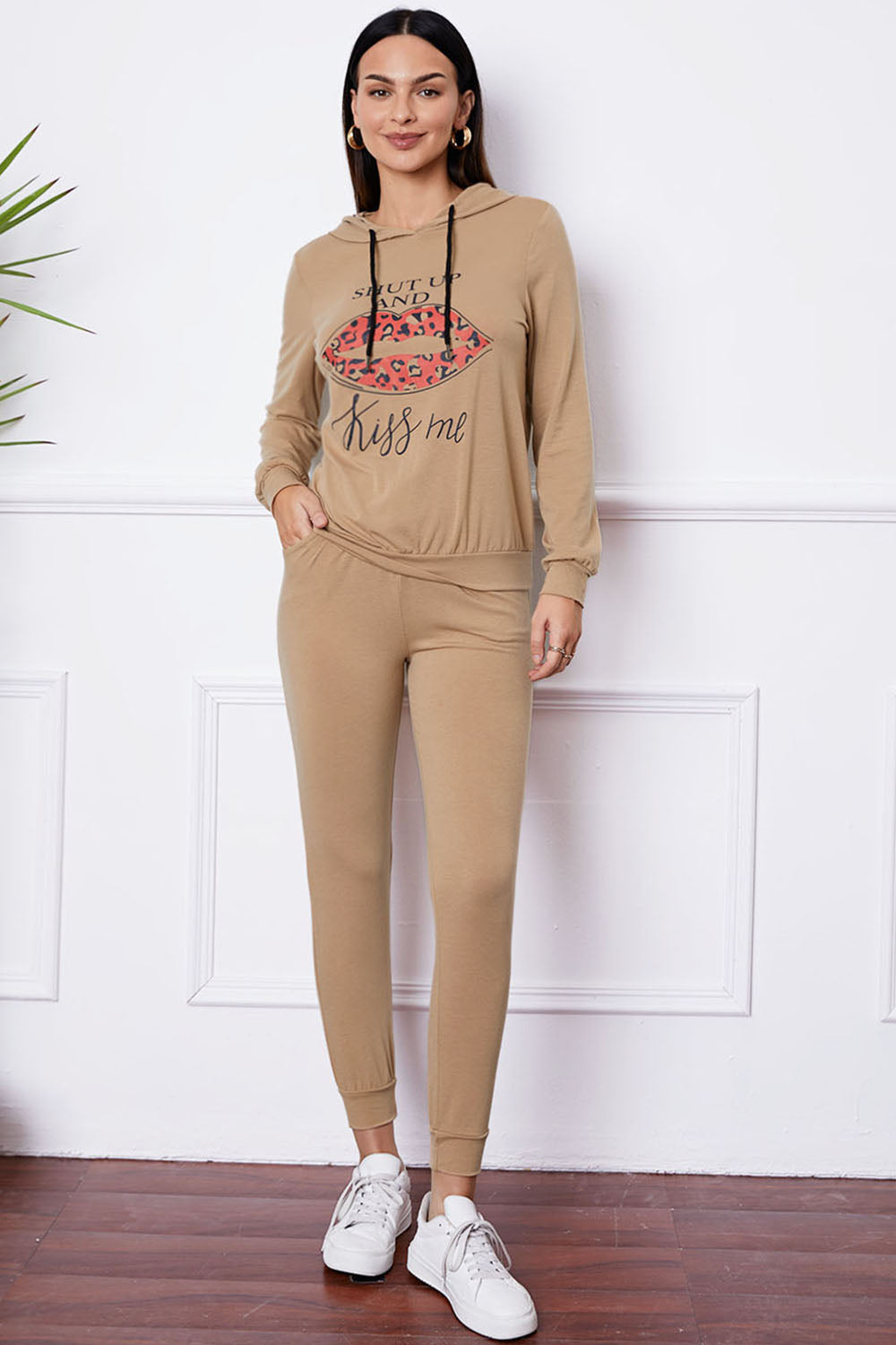 Khaki loungewear set with a graphic lip print and "Kiss me" text on the hoodie.