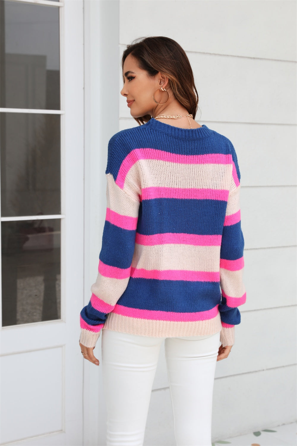 Bold Stripe Crewneck Knit sweater in dark blue, pink, and beige acrylic with crewneck and long sleeves.