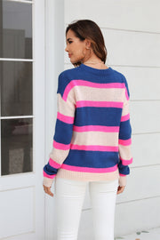Bold Stripe Crewneck Knit sweater in dark blue, pink, and beige acrylic with crewneck and long sleeves.