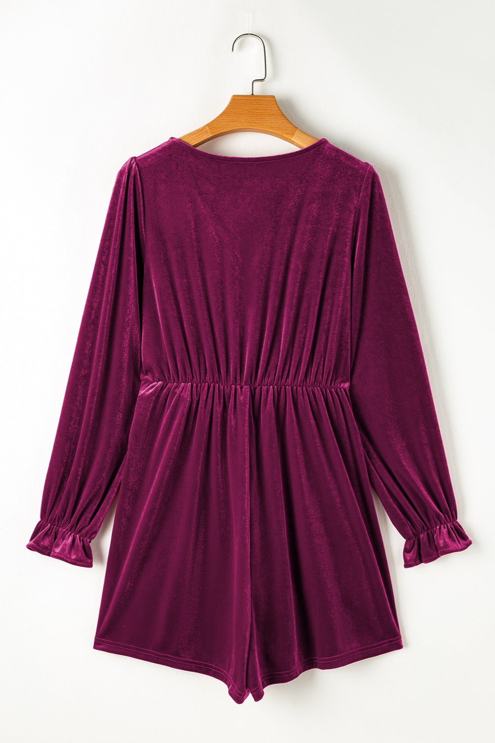 Burgundy velvet wrap romper with ruffled cuffs and cinched waist