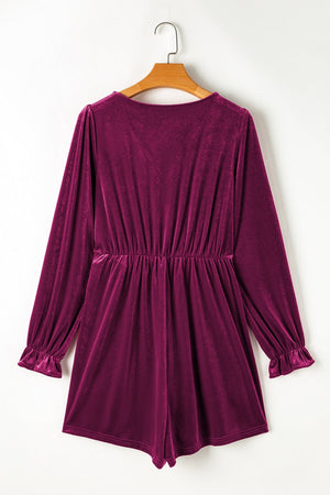 Burgundy velvet wrap romper with ruffled cuffs and cinched waist