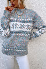 Nordic Fair Isle mock neck sweater in cloudy blue acrylic with snowflake pattern and textured knit.