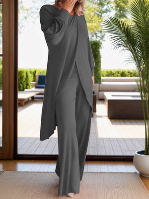 Dark gray draped overlay palazzo co-ord set with wide leg pants and long sleeves.