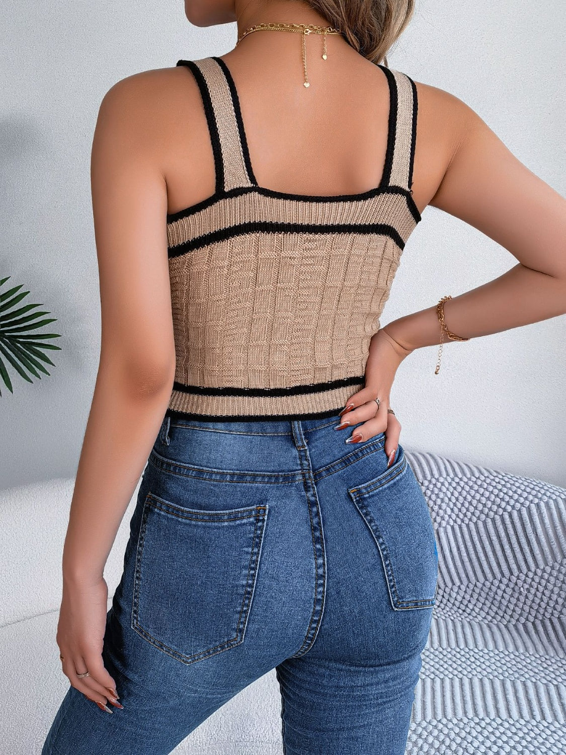 Tan textured knit tank top with black contrast trim and square neckline.