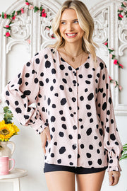 Beige polka dot blouse with balloon sleeves and button front.