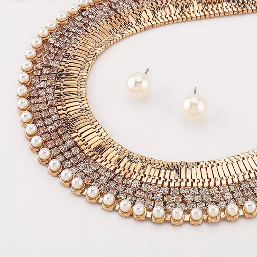 Gold-plated pearl and rhinestone choker necklace with matching stud earrings.