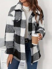 Oversized black and white checkerboard sherpa shacket with button front and chest pockets.
