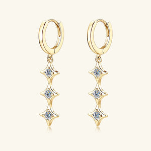 Gold hoop earrings with cascading star-shaped moissanite charms.