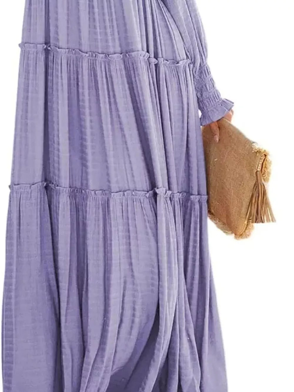Purple smocked v-neck tiered maxi dress with ruffled tiers and smocked cuffs.