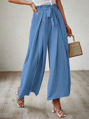 Blue paperbag waist palazzo pants with side slits and tie belt.