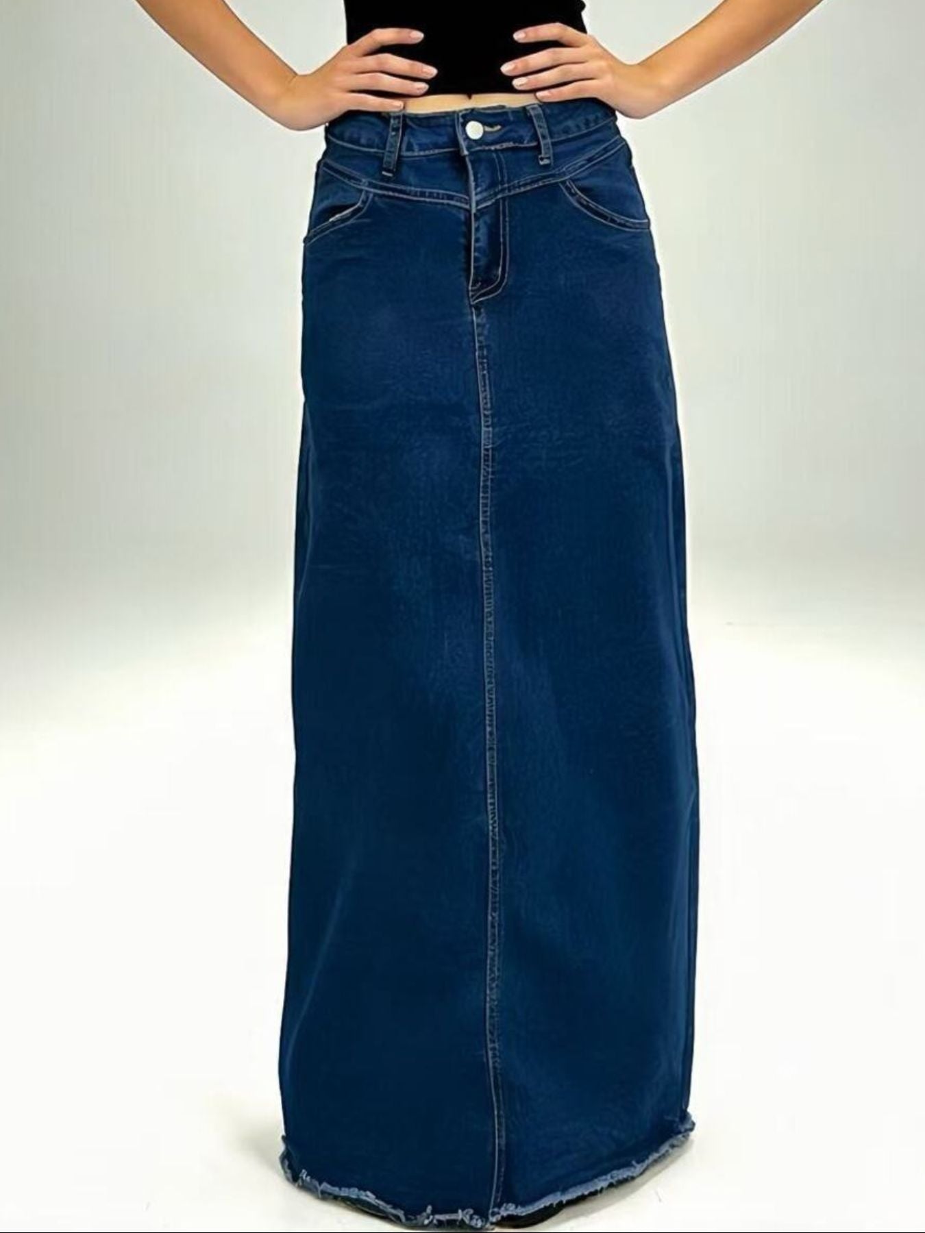 Maxi denim skirt in dark blue with raw hem and button closure.