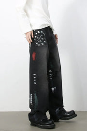 Dark wash wide-leg jeans with artistic paint splatters and distressed details.