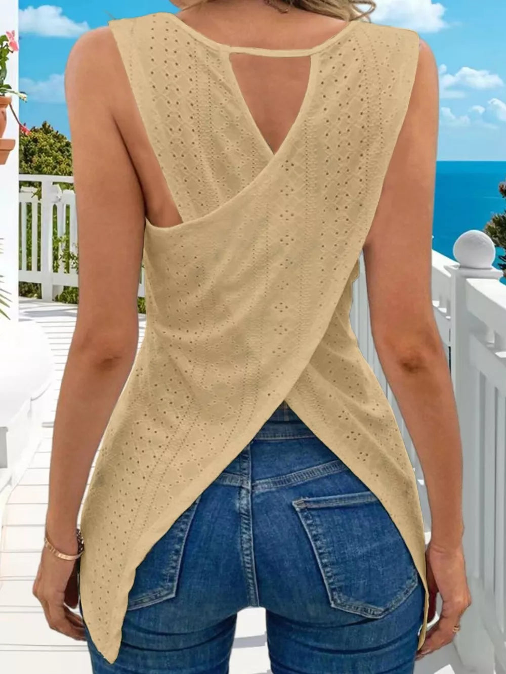 Yellow openwork knit tank top with crisscross back detail and crew neck.
