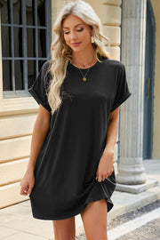 Black t-shirt dress with cuffed short sleeves and a crew neck.