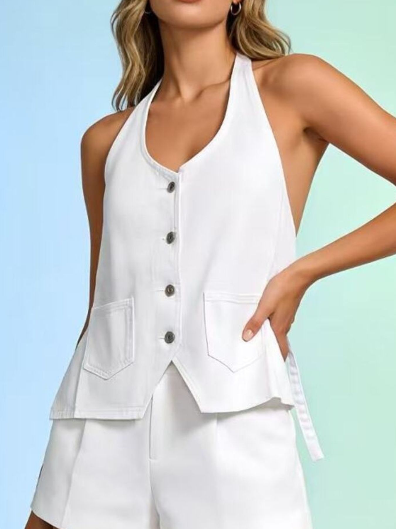White denim button-down halter vest with V-neck and two front pockets.