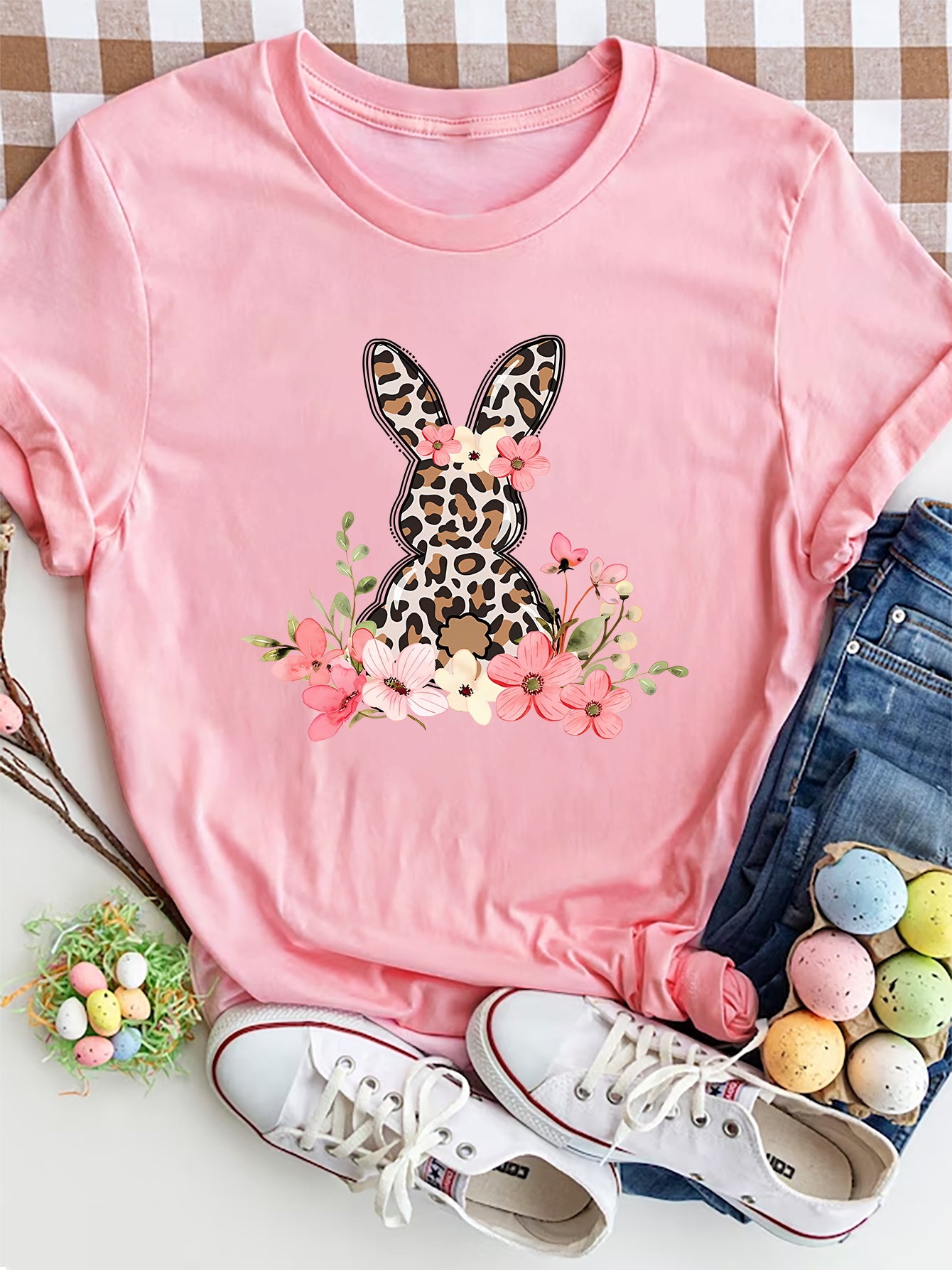 Dusty pink crewneck tee with a leopard print bunny graphic surrounded by flowers.
