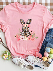 Dusty pink crewneck tee with a leopard print bunny graphic surrounded by flowers.
