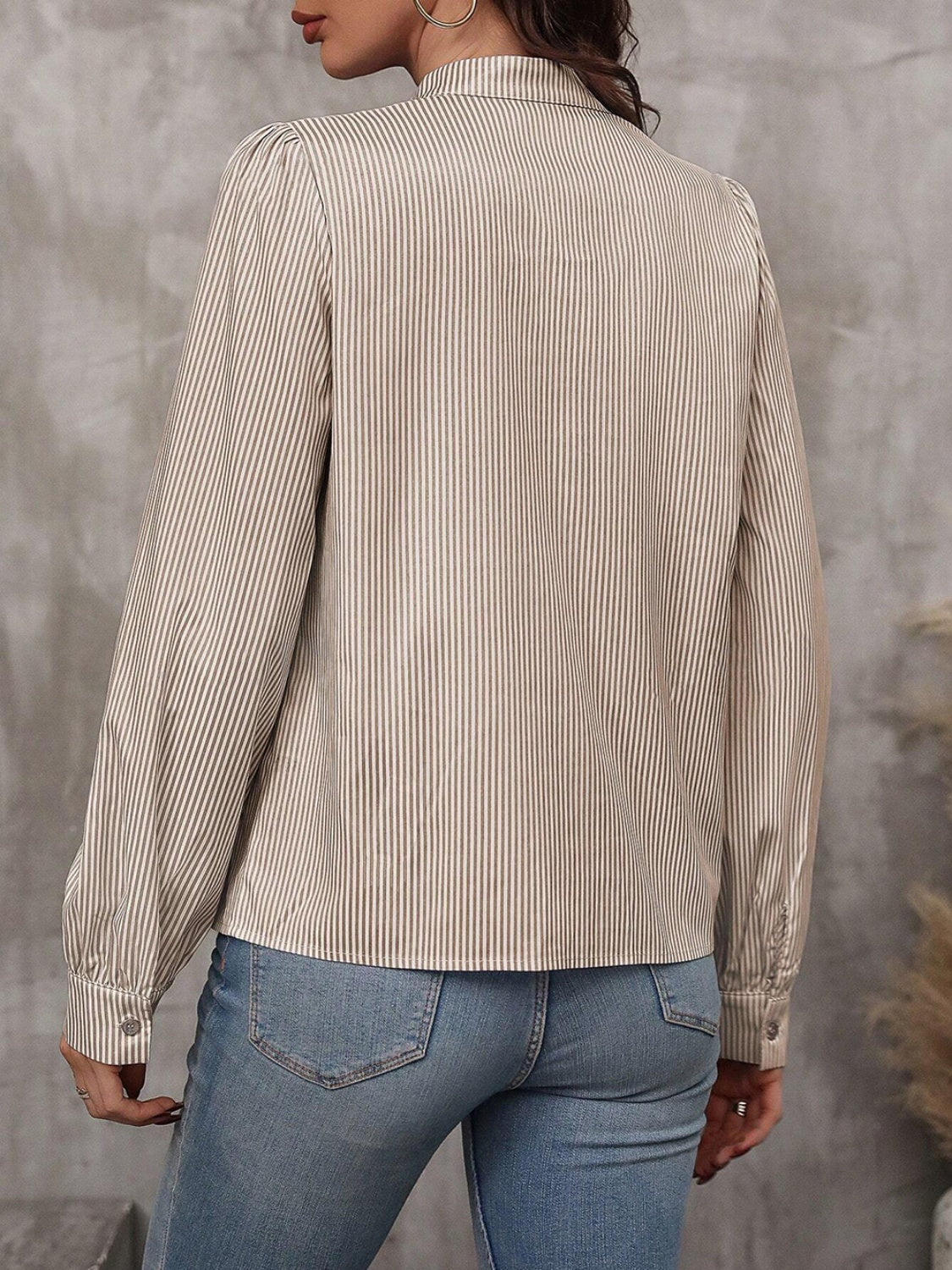 Puffed sleeve stripe blouse in khaki with button cuff and high neckline.