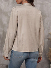 Puffed sleeve stripe blouse in khaki with button cuff and high neckline.