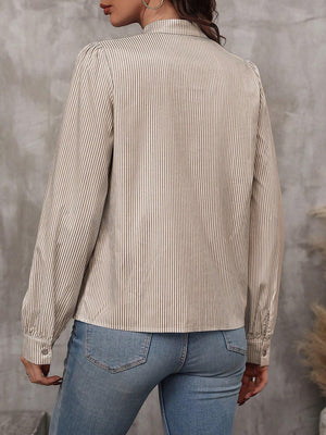 Puffed sleeve stripe blouse in khaki with button cuff and high neckline.