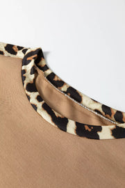Camel t-shirt with leopard print trim on the neckline.