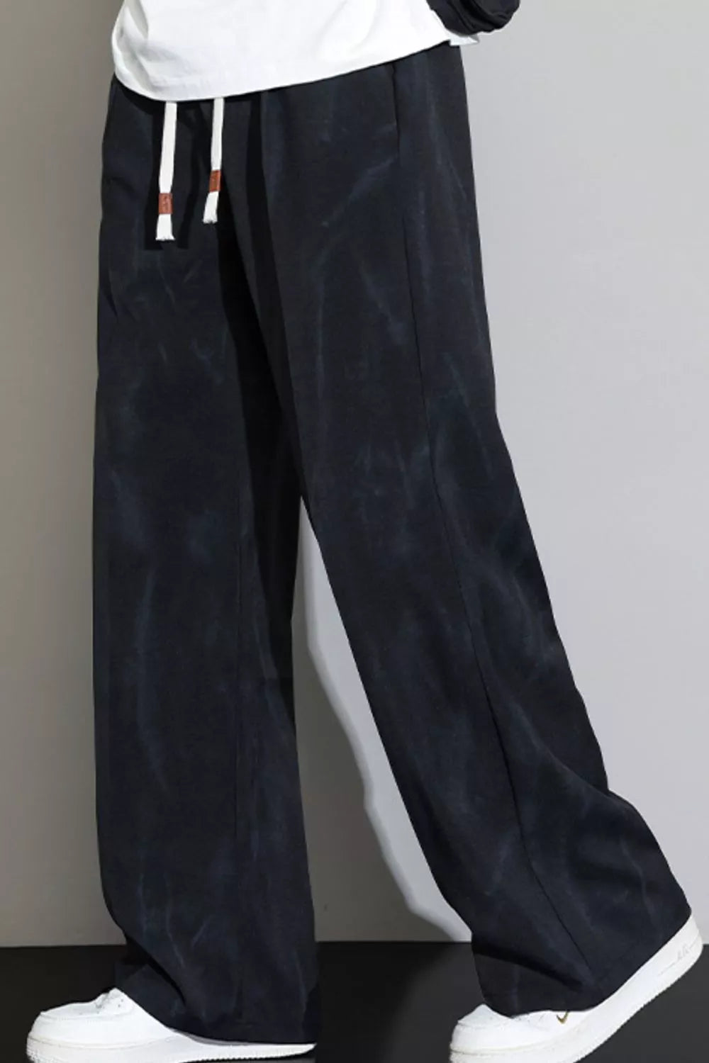 Men's black marbled thermal drawstring sweatpants with a relaxed fit.