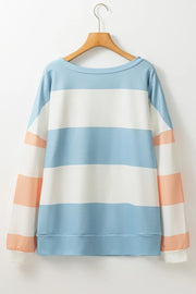 Striped sweatshirt with block sleeves in light blue, white, and blush pink.