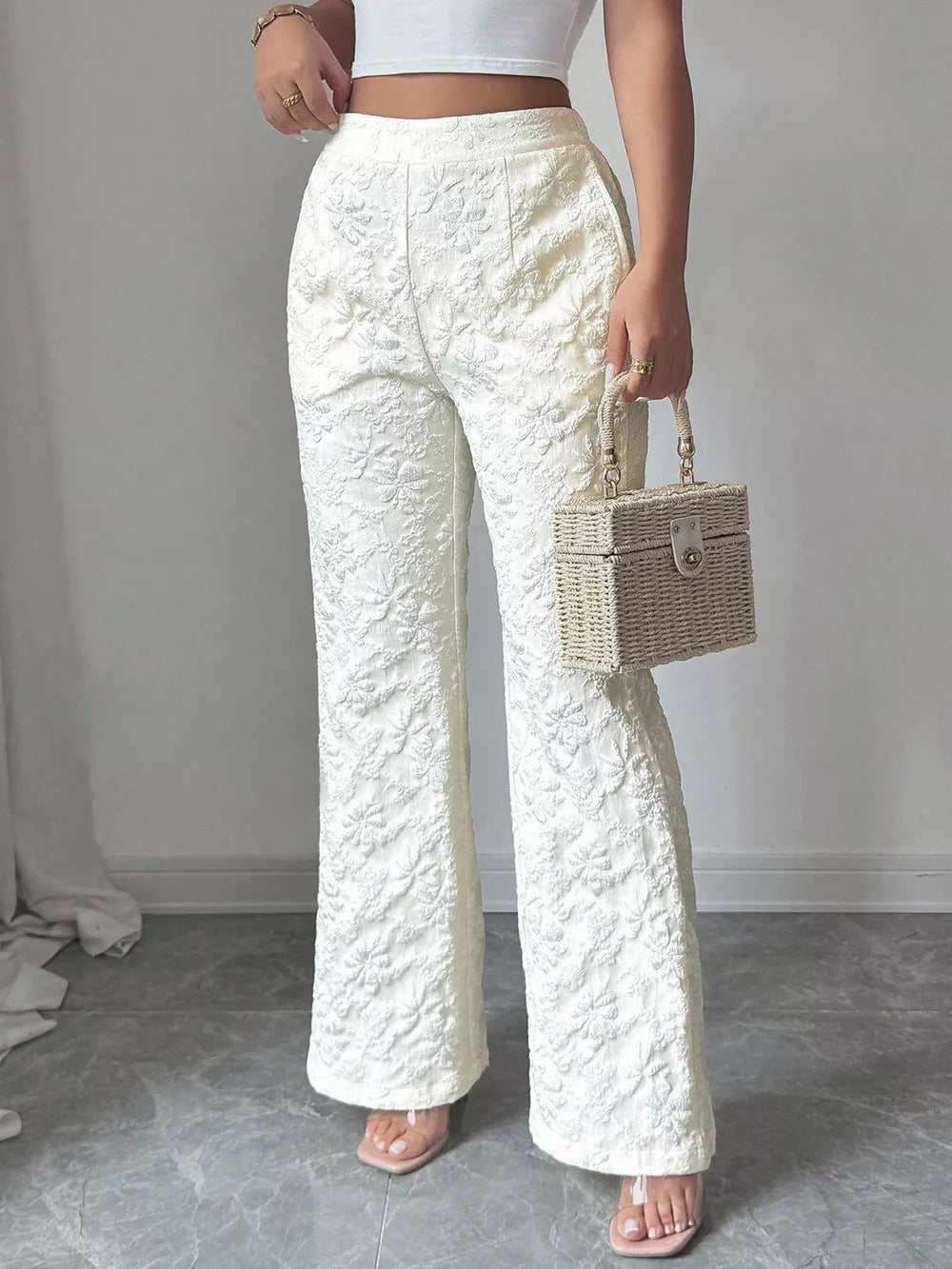 White floral textured high-waisted maternity pants with a wide leg