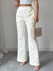 White floral textured high-waisted maternity pants with a wide leg