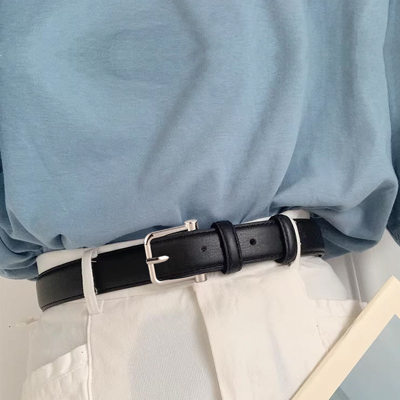 Classic black cowhide leather belt with silver buckle, adjustable for adults.