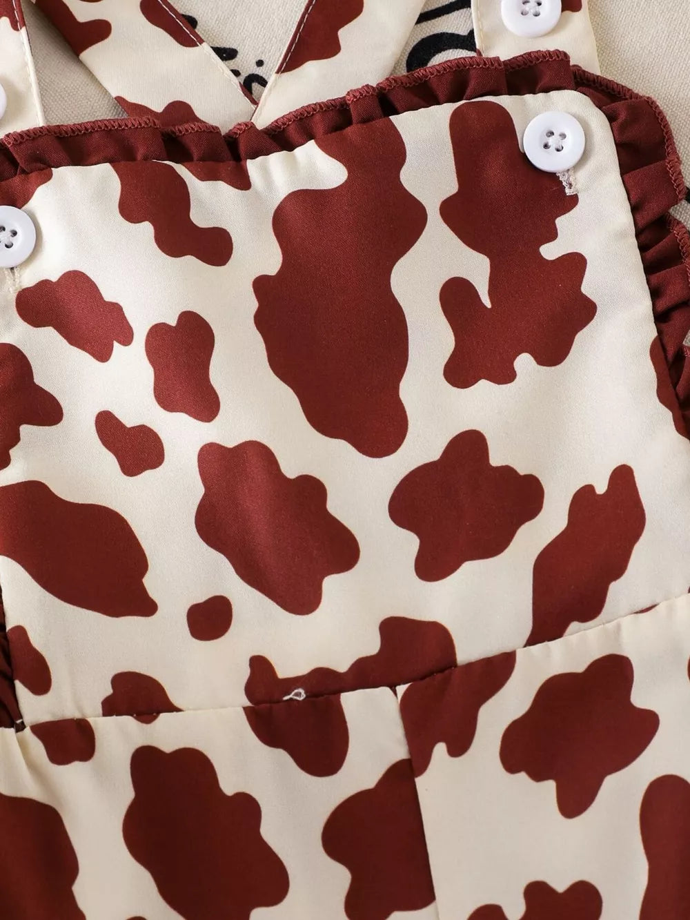 Children's Cow Print Ruffle Jumpsuit in Brown And White, editorial view