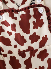 Children's Cow Print Ruffle Jumpsuit in Brown And White, editorial view