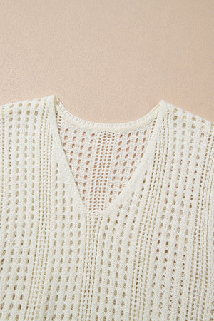 Beige open-knit mini dress with V-neck and drawstring waist detail.