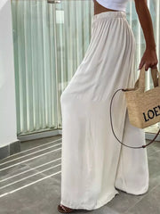 Apricot maternity pants with paperbag waist and wide legs.