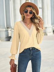 Canary yellow eyelet lace inset blouse with blouson sleeves and ruffled cuffs.