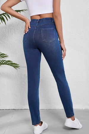 Sculpted denim high-waisted pull-on jeans in medium wash, featuring a slim fit and back pockets.