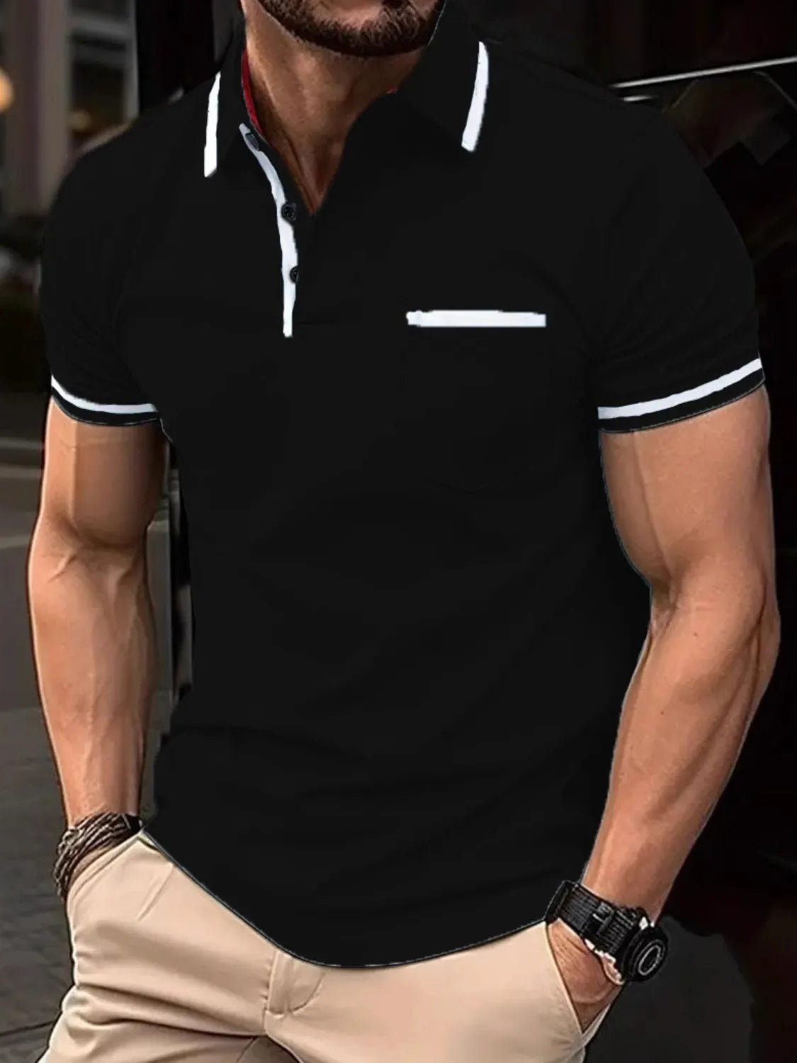 Black short sleeve polo with contrast white trim on collar, pocket, and sleeves.