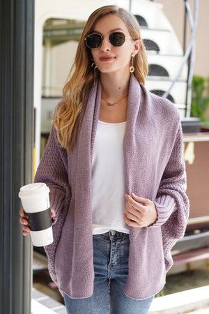 Purple batwing knit cardigan with drape front and textured sleeves, acrylic.