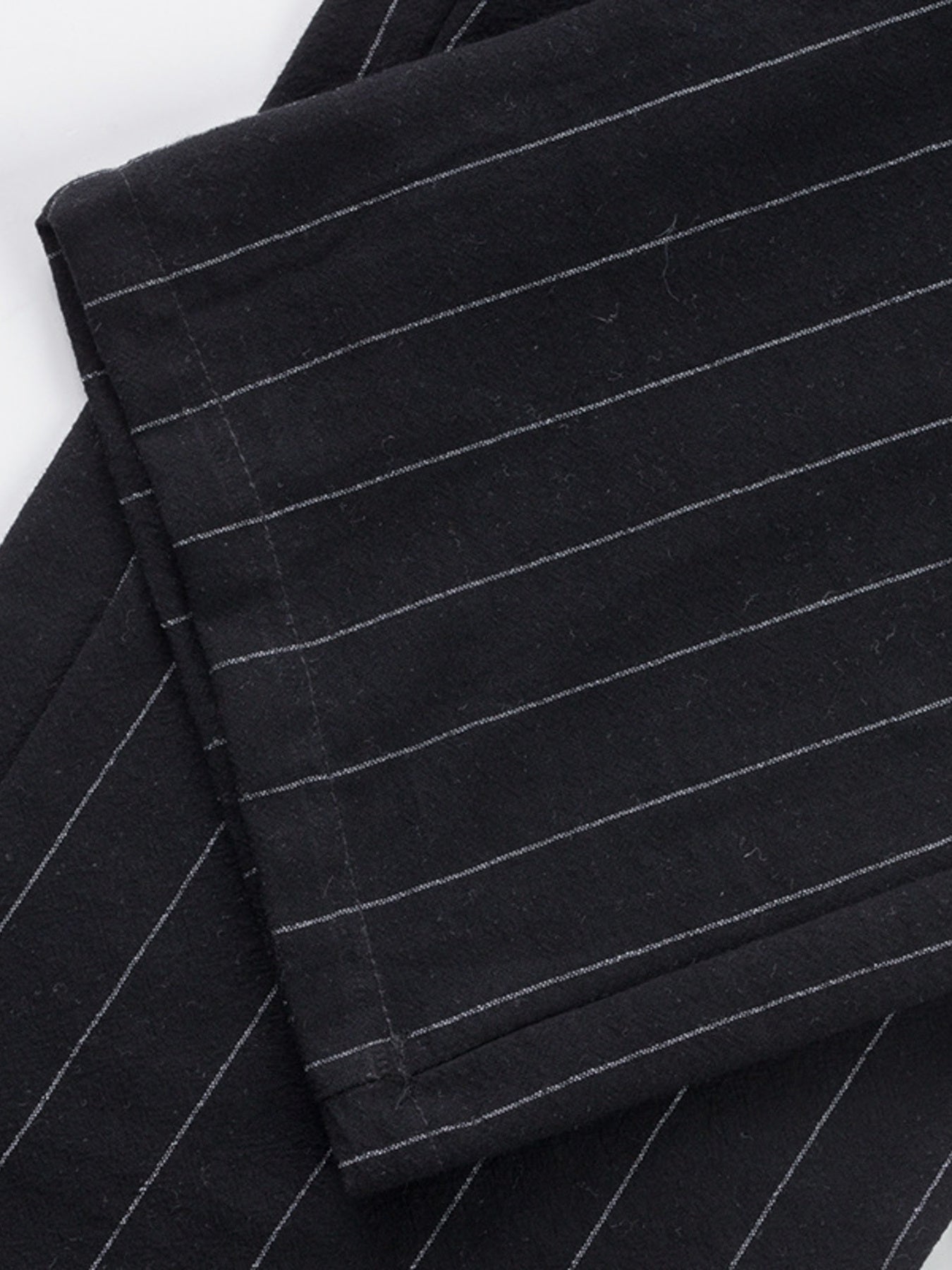 Black striped sweatpants with a wide-leg cut.