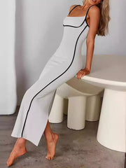 White spaghetti strap maxi dress with black contrast piping and a bodycon fit.