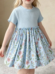 Baby blue ribbed knit dress with floral print skirt and ruffled details.