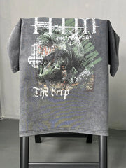 Acid wash graphic t-shirt in dark gray with "The Drip" text and a detailed graphic print.