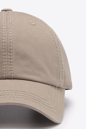 Beige canvas baseball cap with contrast stitching detail.