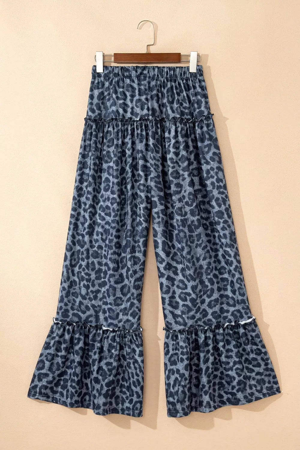Maternity wide-leg pants in dark navy with leopard print and ruffled hems.
